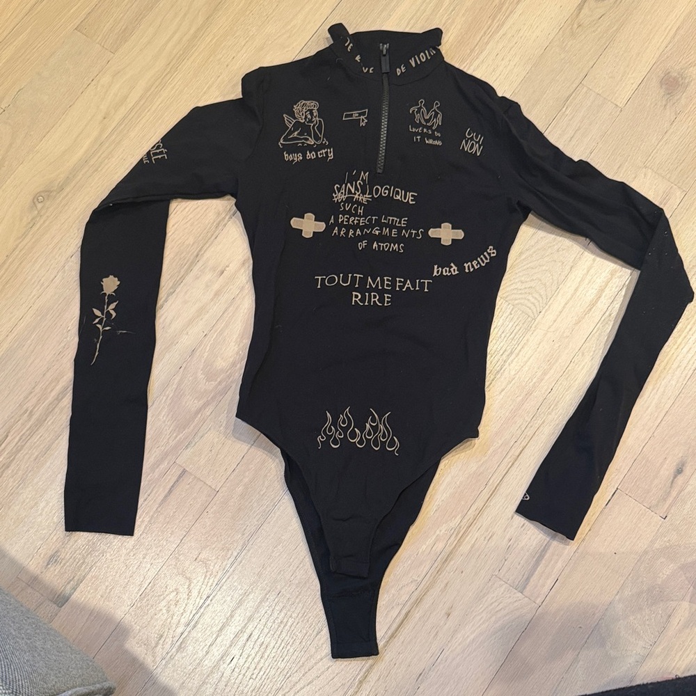 Black Graphic One Piece Zipped Turtle Neck by TTSWTRS